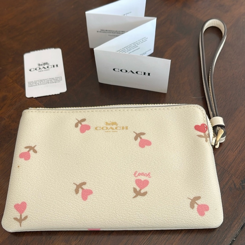 Authentic Coach corner zip wristlet with heart flowers